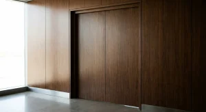 A discreet luxury business environment featuring closed boardroom doors and elegant minimalist architecture